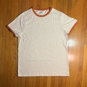 Basic white T-shirt with orange on the collar and sleeves